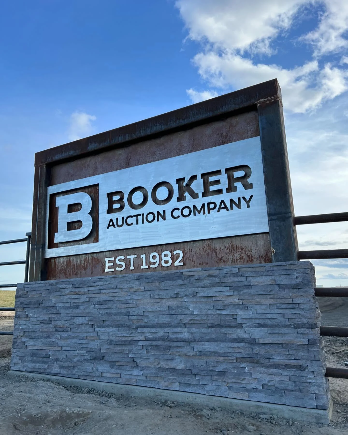 Stone base beneath the Booker Auction Company sign, built by Alano Masonry