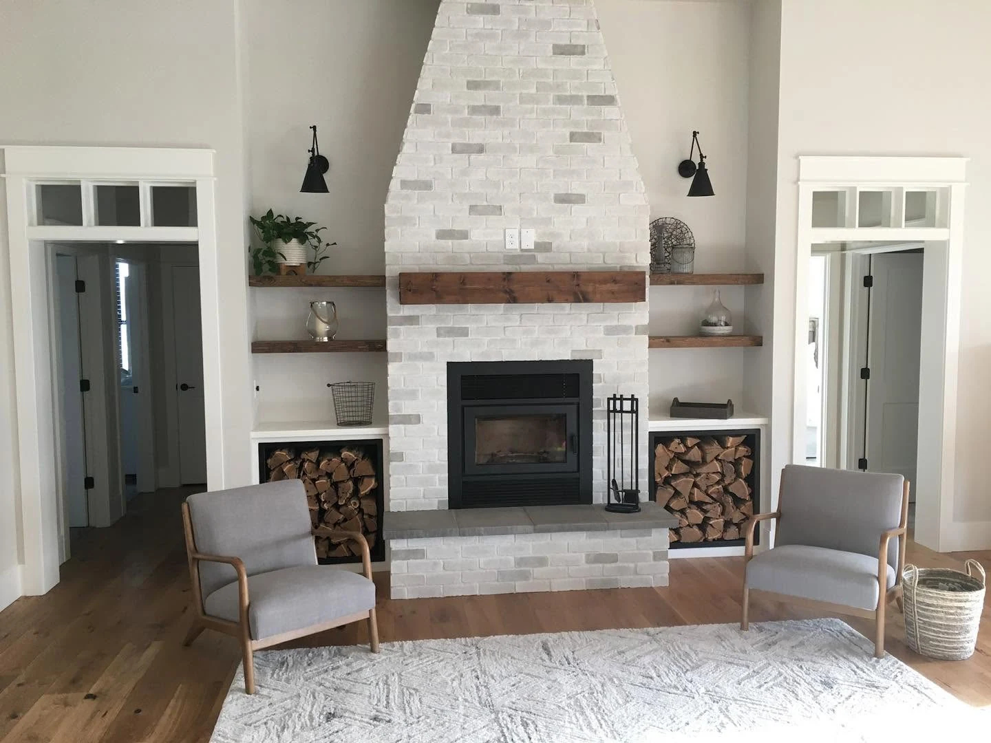 A light-toned masonry fireplace surround brings texture and a welcoming focal point to this living room.